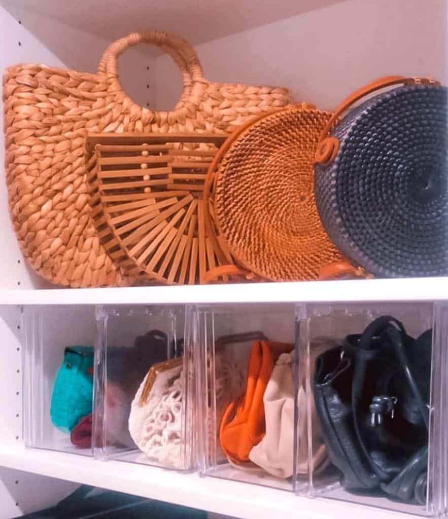 Shelves holding various woven handbags and clear bins storing colorful purses