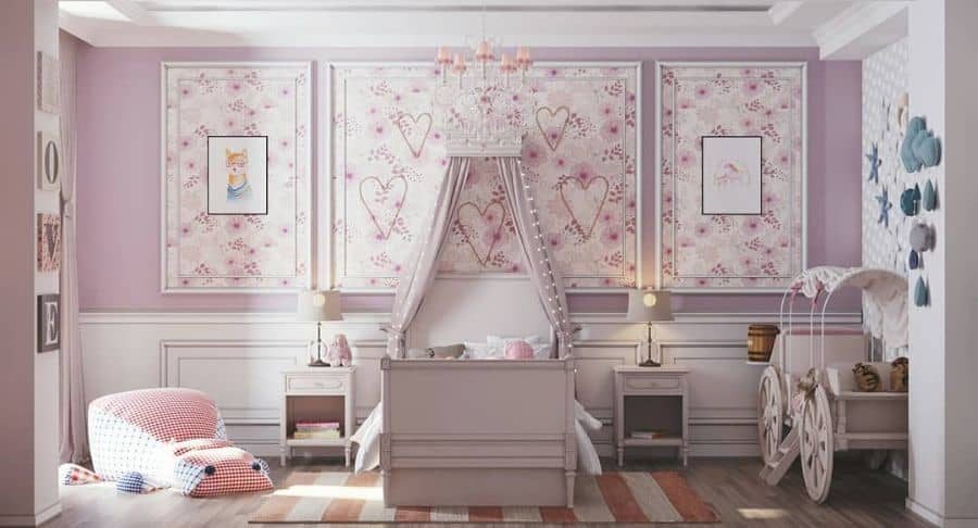 Whimsical girls' bedroom with a canopy bed, heart-patterned wall panels, pink chandelier, cozy reading nook, and carriage-style crib