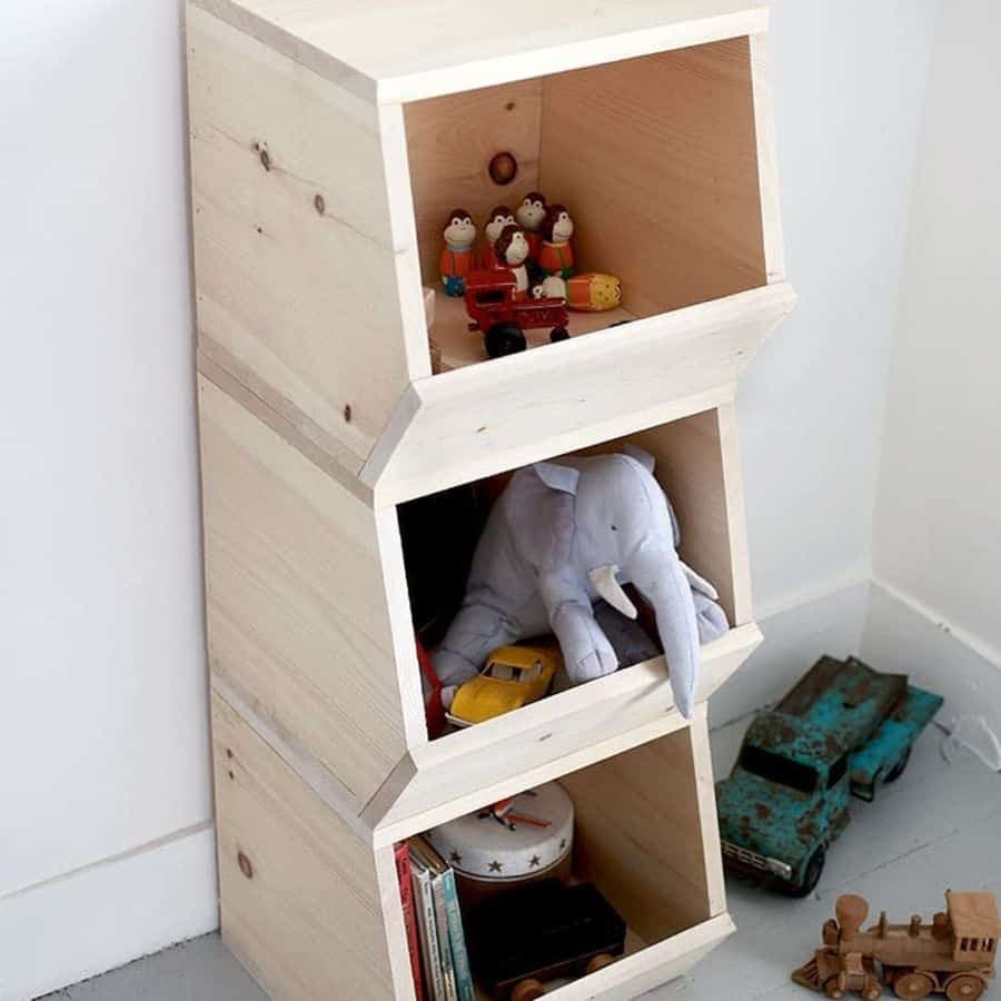 Rustic wooden storage unit in a kids' room, filled with stuffed animals, books, and vintage toy cars for an organized play space