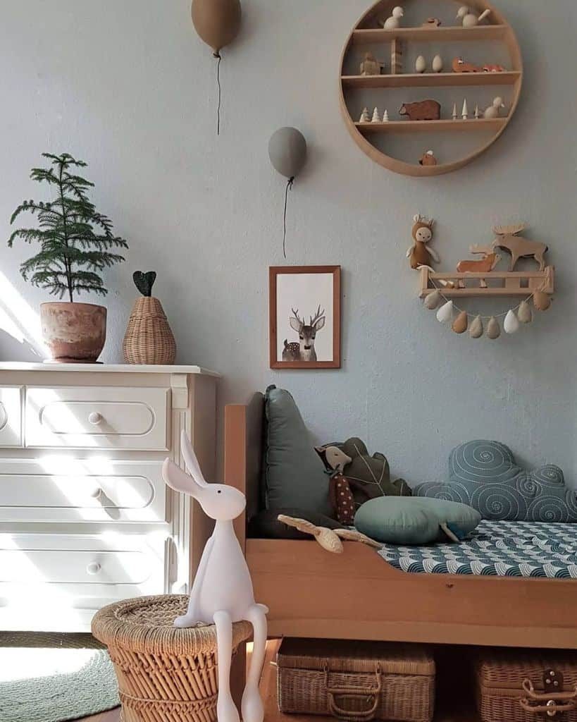 Cozy kids' room with wooden furniture, nature-inspired decor, soft cushions, wicker baskets, and playful wall-mounted wooden shelves