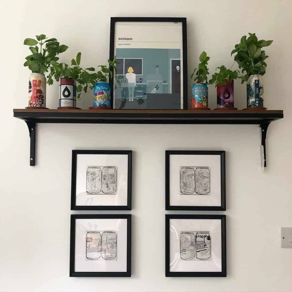 Indoor herb garden with basil and other herbs growing in upcycled colorful cans on a wooden shelf, adding greenery to a modern wall display