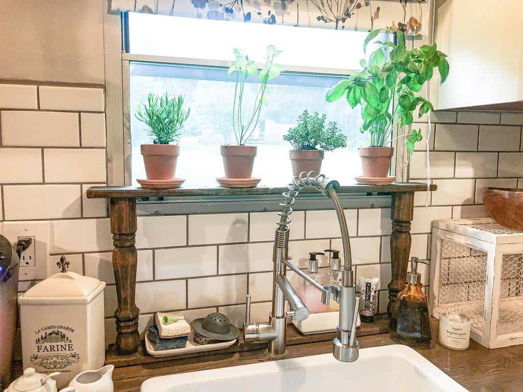 Kitchen herb garden with potted basil, rosemary, and thyme on a wooden shelf above the sink, adding freshness to a rustic space