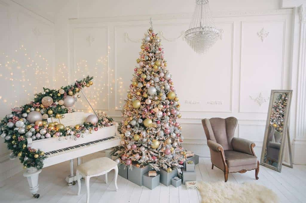 Luxurious room with a decorated Christmas tree adorned with rose gold and silver ornaments