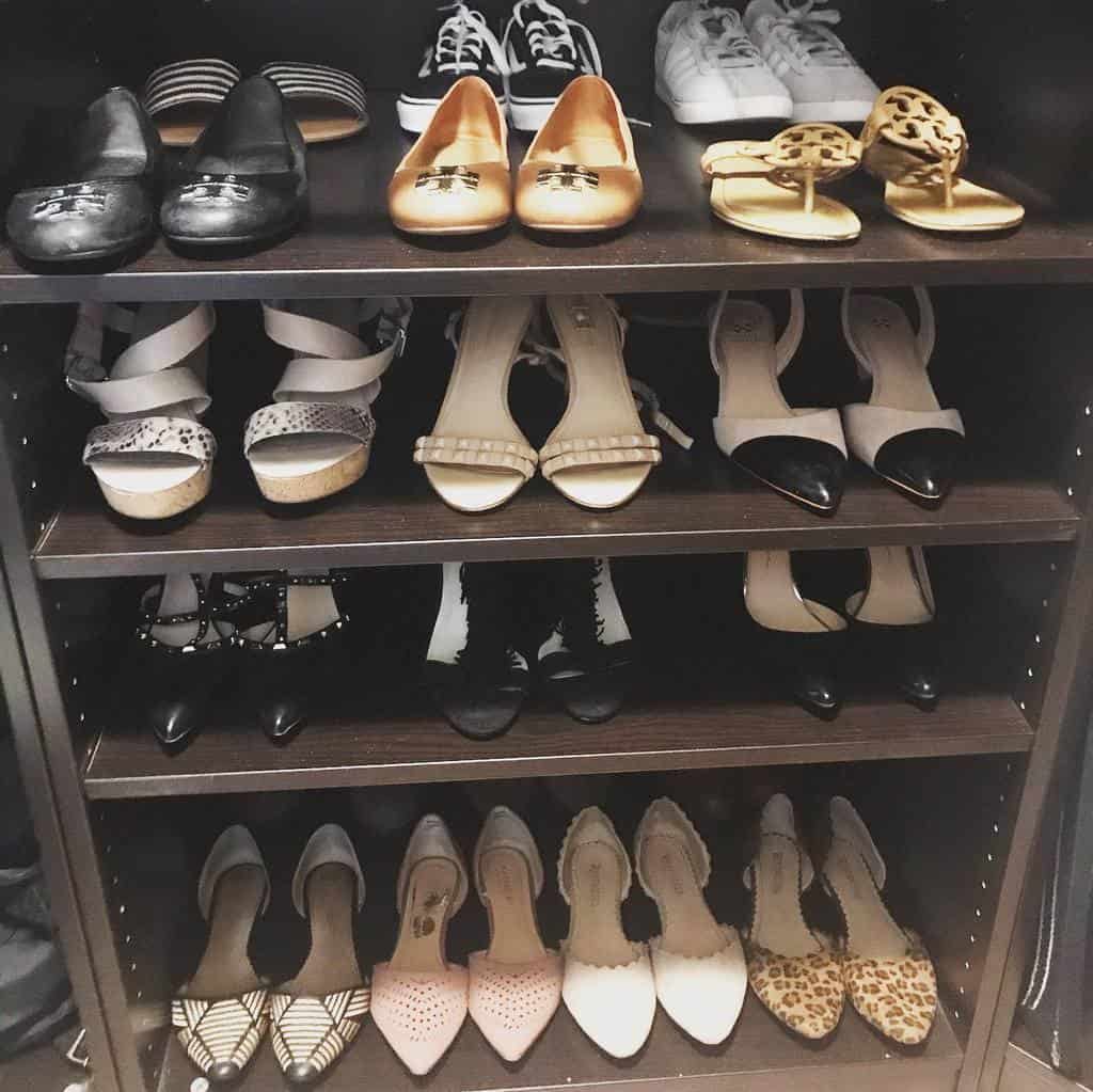 A neatly organized shoe shelf with various women's shoes, including flats, sandals, and sneakers, in different colors and patterns