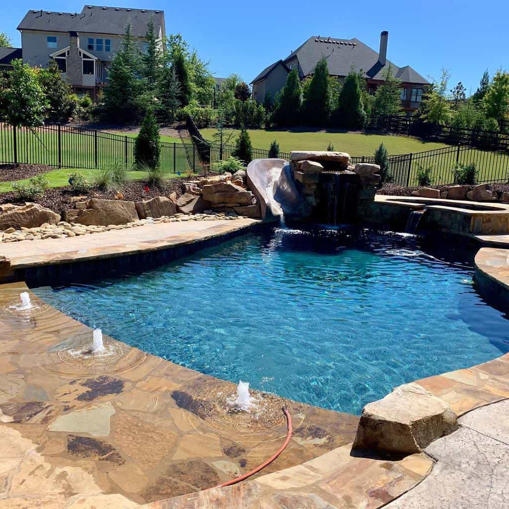 swimming pool with cobblestone edging