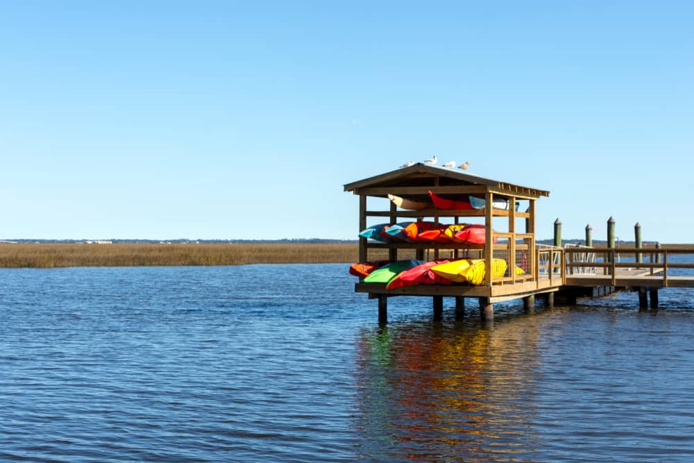 Colourful kayaks stored on a dock