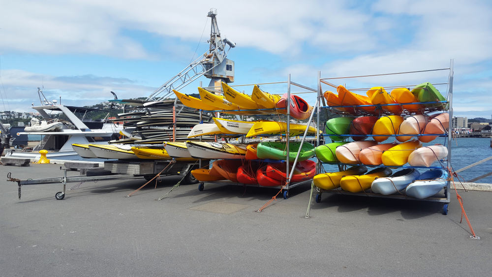 Racks of colorful sea kayaks
