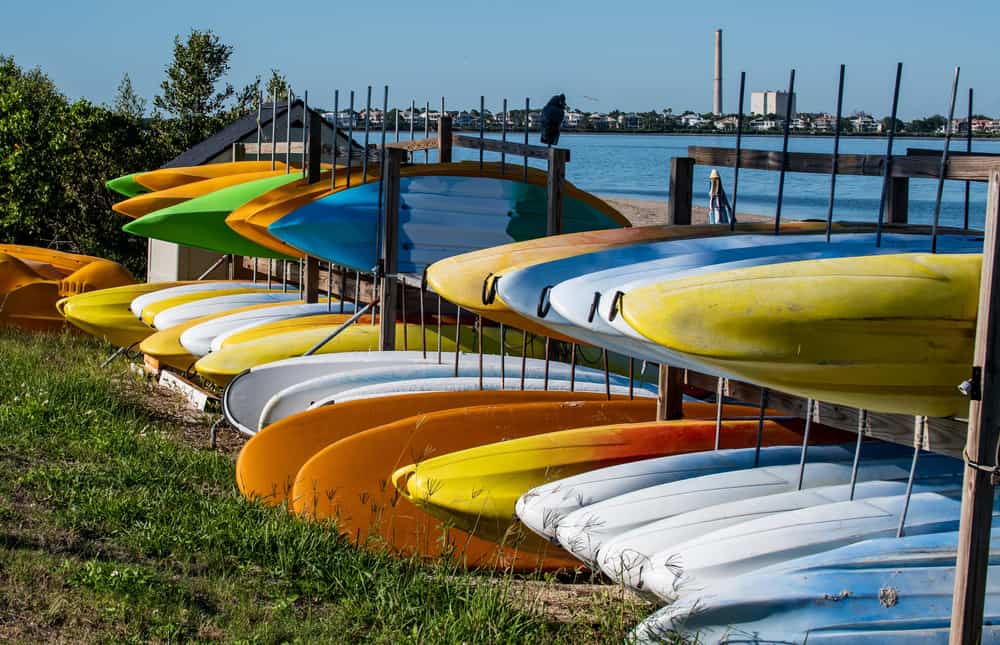 Riverside kayak storage in sunlight