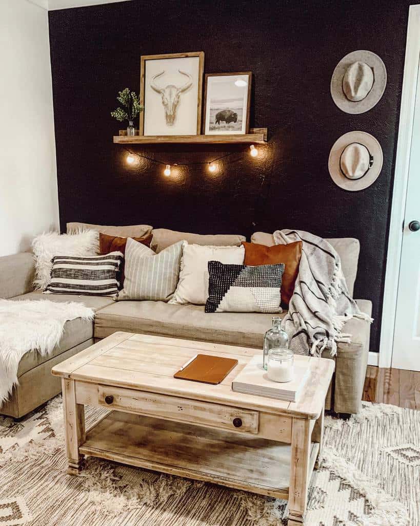 Rustic wooden coffee table with a distressed finish, styled with a candle, book, and notebook, set in a cozy boho living room with warm tones