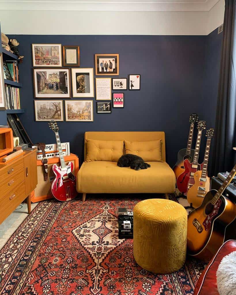 Stylish music room with a mustard sofa, vintage rug, guitars, framed artwork, and a cozy atmosphere with a sleeping dog