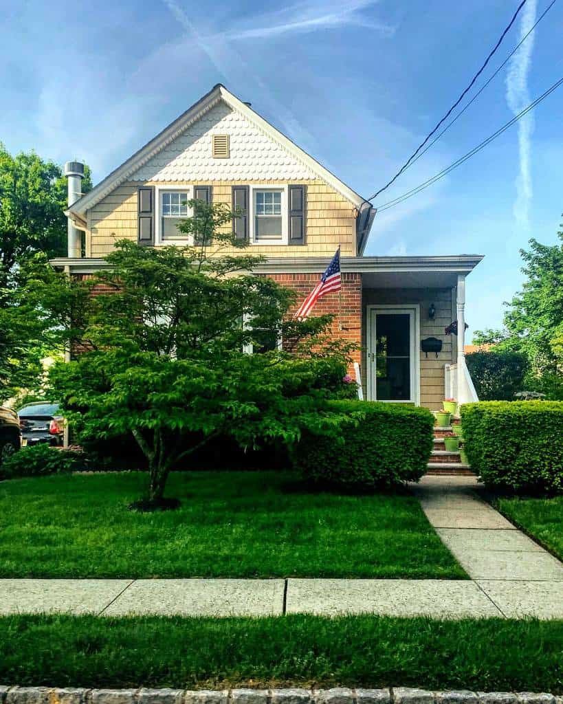 Front yard with well maintained hedges