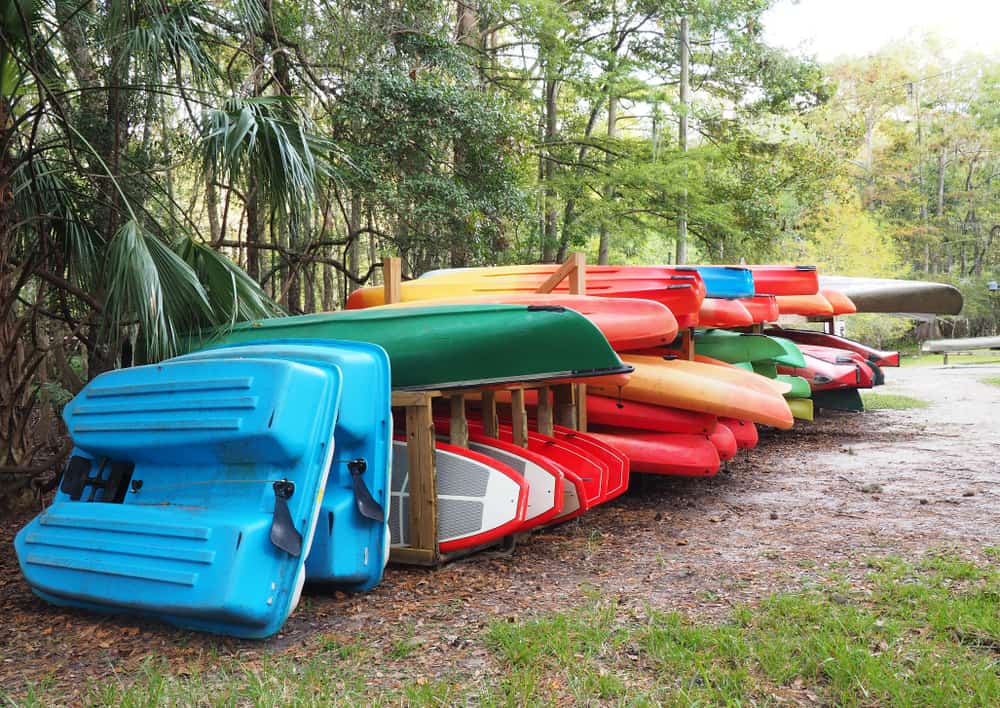 Outdoor storage of colorful kayaks