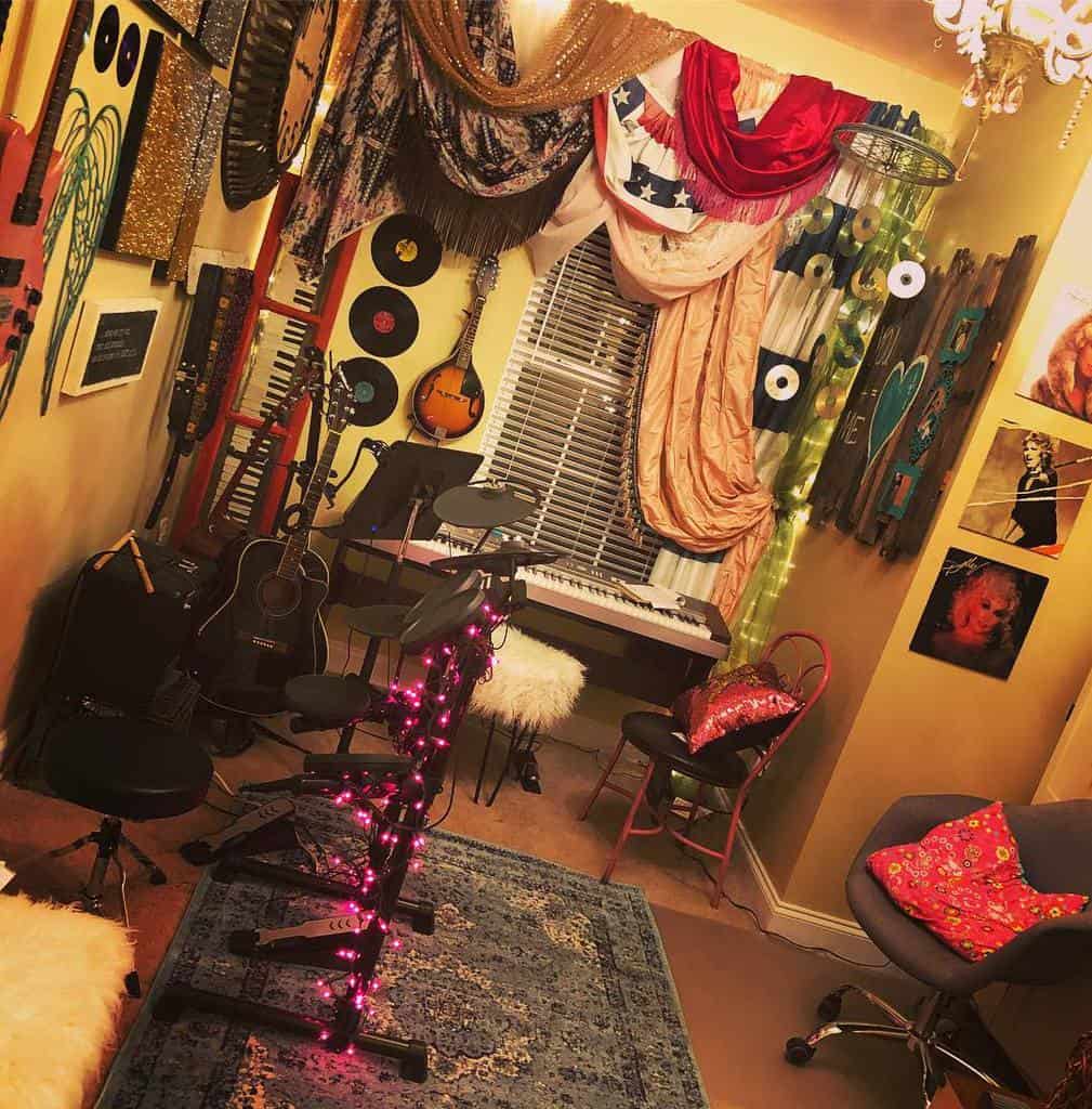 Eclectic music room with guitars, a keyboard, electronic drums with pink fairy lights, vinyl records, colorful decor, and vintage accents