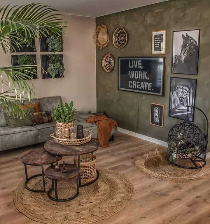 Rustic nesting coffee tables with round wooden tops and black metal legs, styled with woven baskets, plants, and candles in a cozy boho living room