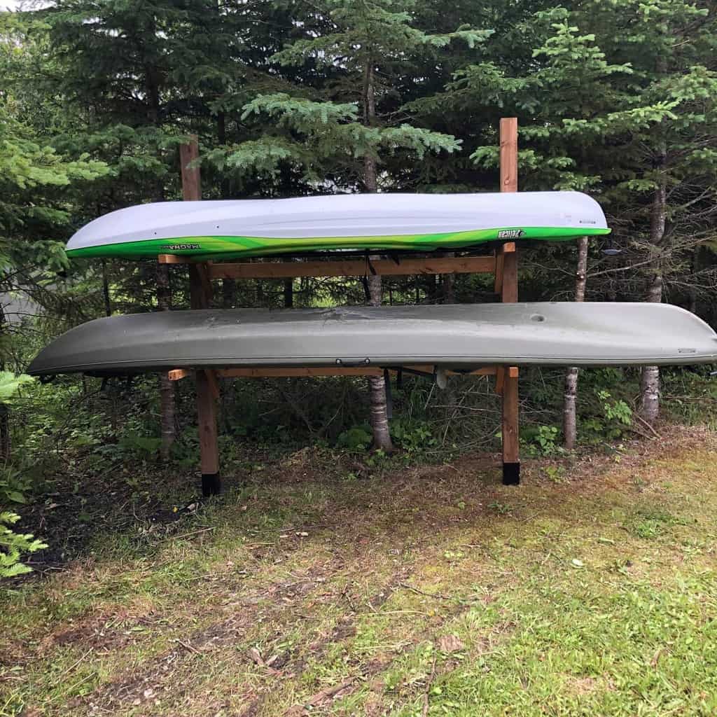 kayak rack storage under a tree