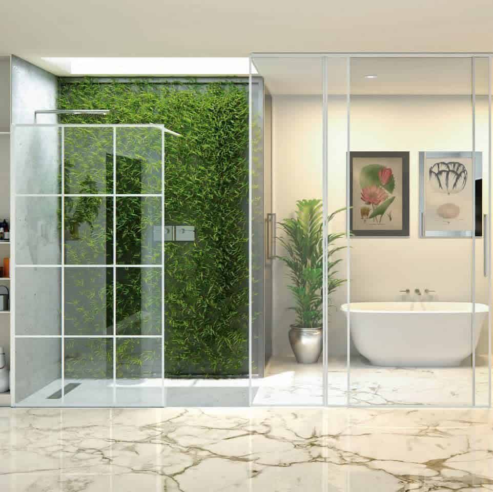 Modern wet room with a glass-walled shower and green vertical garden, featuring a white bathtub, marble flooring, and two framed artworks