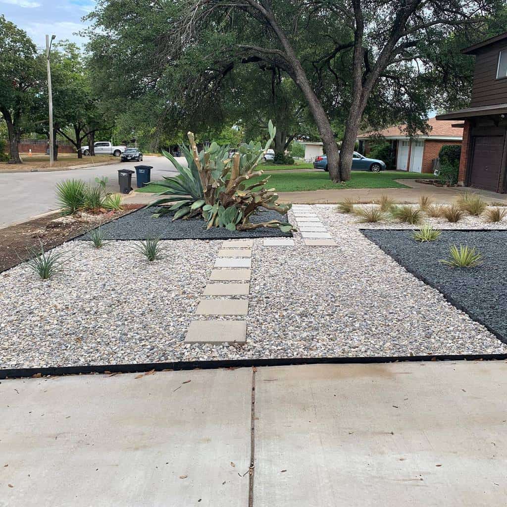 Modern front yard xeriscape with gravel, stepping stones, drought-tolerant plants, a large cactus, and black mulch accents