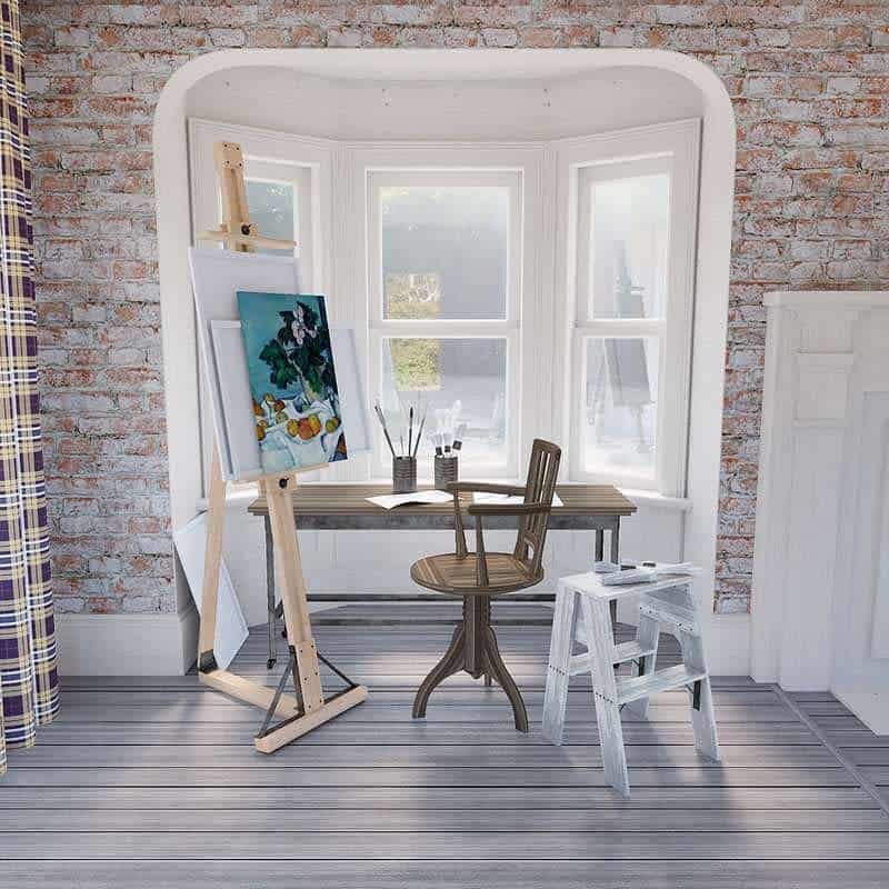 Art studio with easel, painting, and supplies near a window with natural light, next to a wooden chair and a small step stool