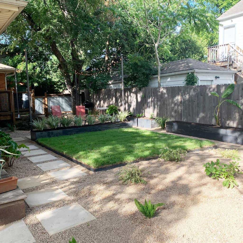 Backyard xeriscape with gravel, stepping stones, a raised lawn, drought-tolerant plants, and cozy seating under string lights