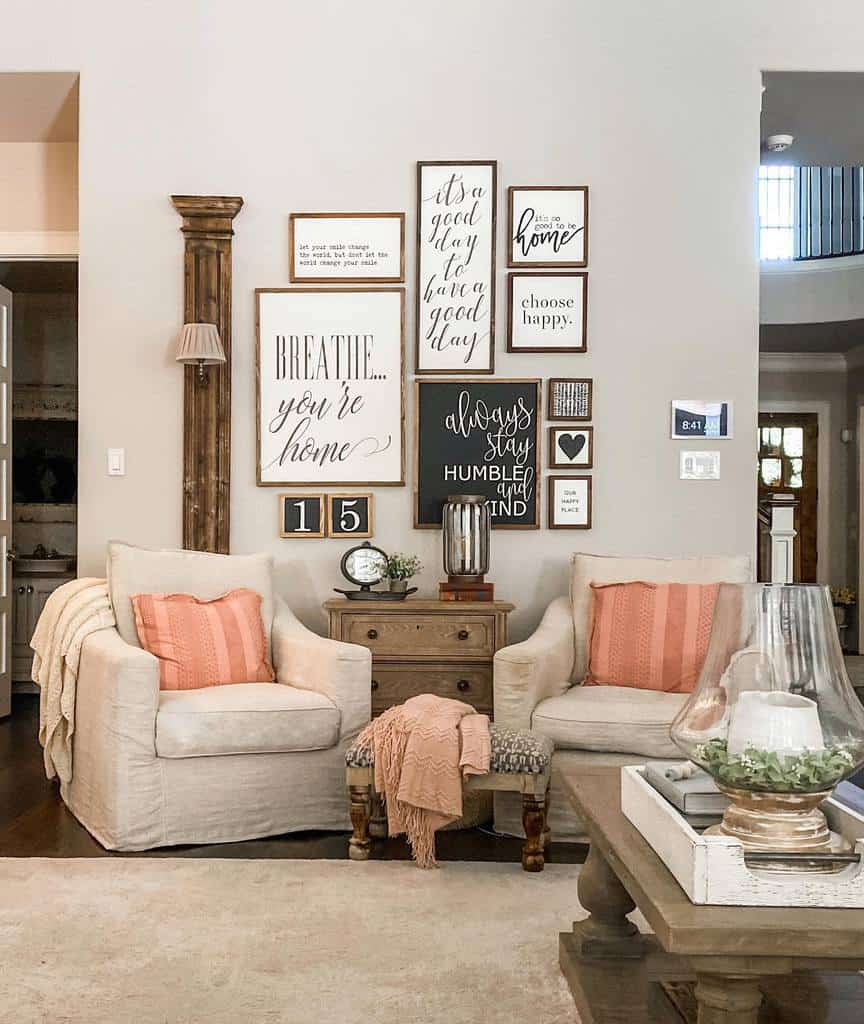 Cozy living room with a gallery wall of inspiring wood signs, including 'Breathe... you're home' and 'Always stay humble and kind,' with neutral decor