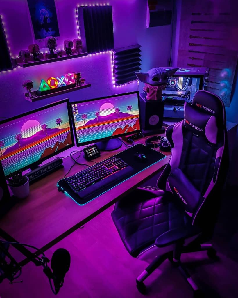 A gaming setup with dual monitors displaying a retro wave theme, RGB keyboard, gaming chair, and purple ambient lighting