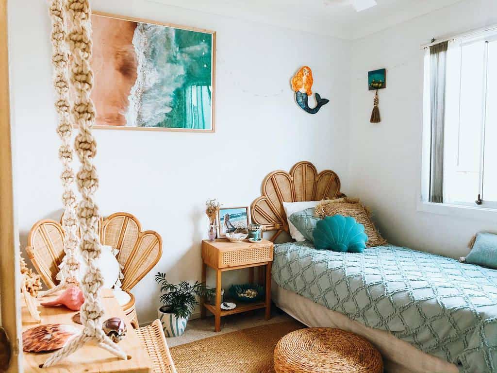 Cozy bedroom with a beach-themed decor, wicker furniture, a seashell motif, and a large ocean photograph on the wall