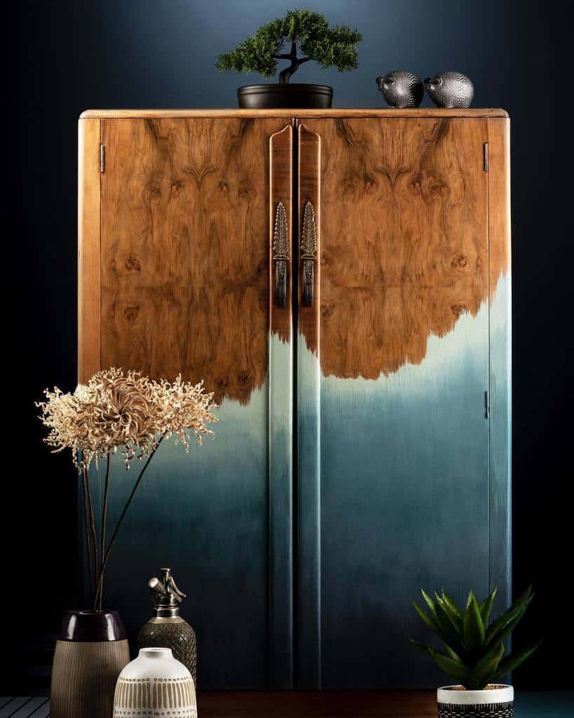 Elegant wood and teal ombre-painted cabinet with a natural finish, blending rich wood grain with a soft gradient for a modern artistic look