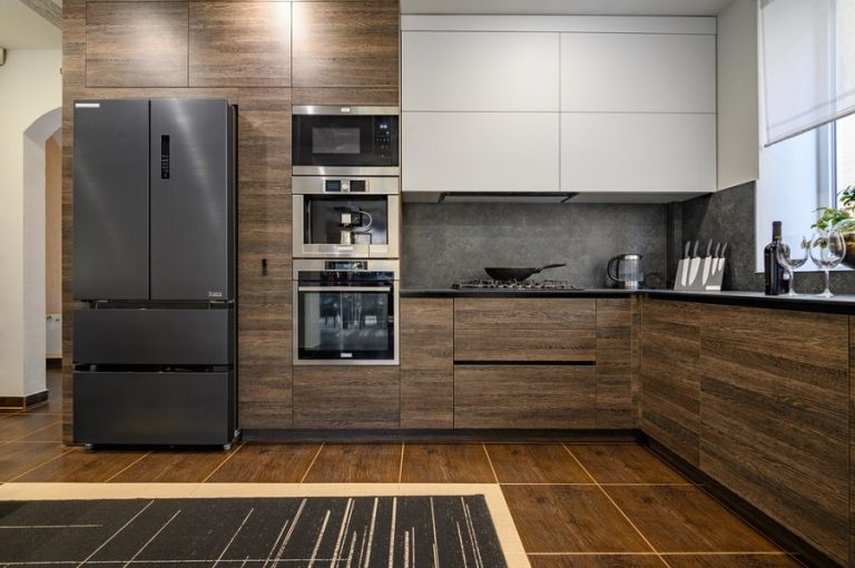 Black stainless steel appliances in kitchen