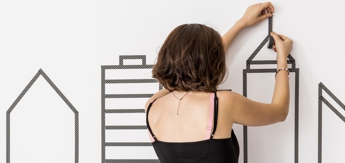 Woman applying wall decals