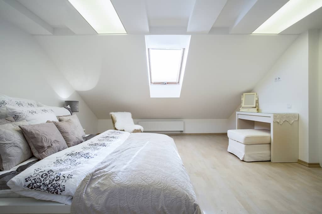 minimalist bedroom with slanted walls