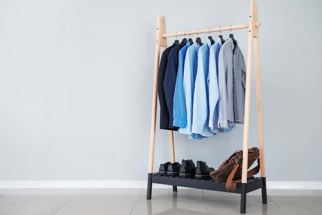 store clothes in a clothing rack without a closet