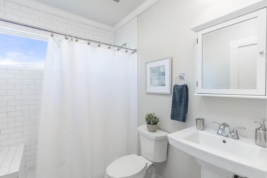 white bathroom with shower curtain