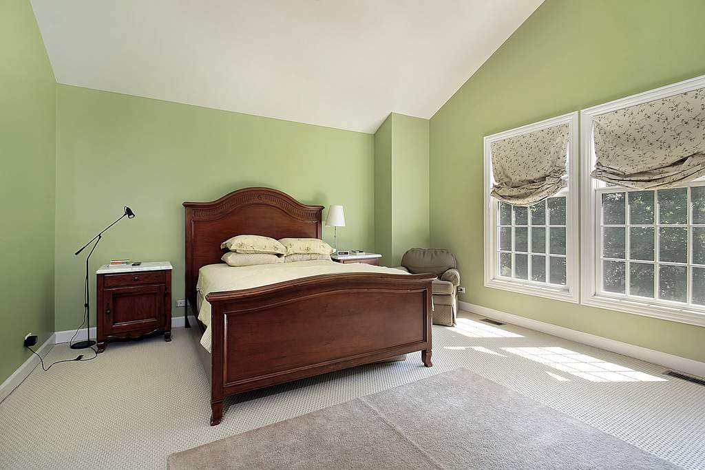 dark color cherry wood furniture in a bedroom