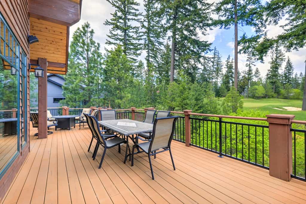 Wooden deck and chairs in large cabin home