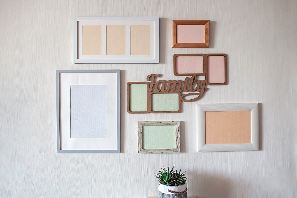 blank photo frames hanging in the wall interior