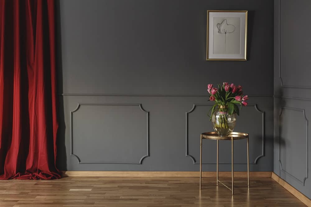 living room on grey wall with red curtains