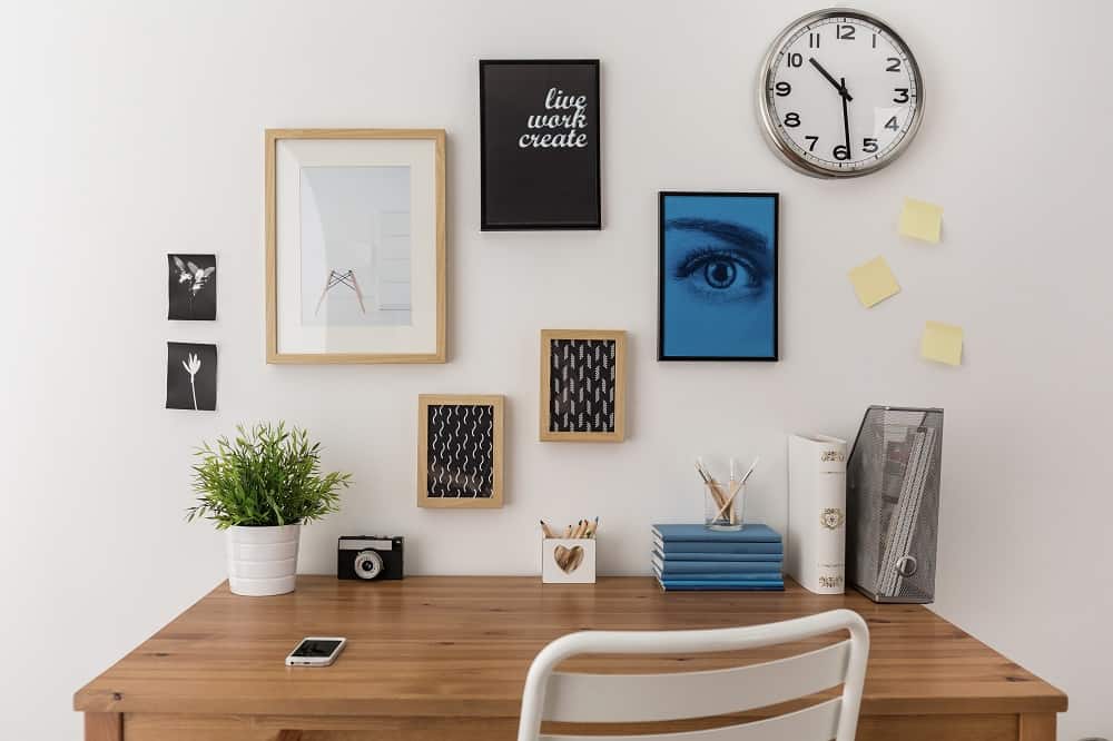 photo frames hanging in the wall interior concept