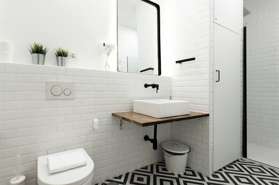 white color paint with black and white tile bathroom