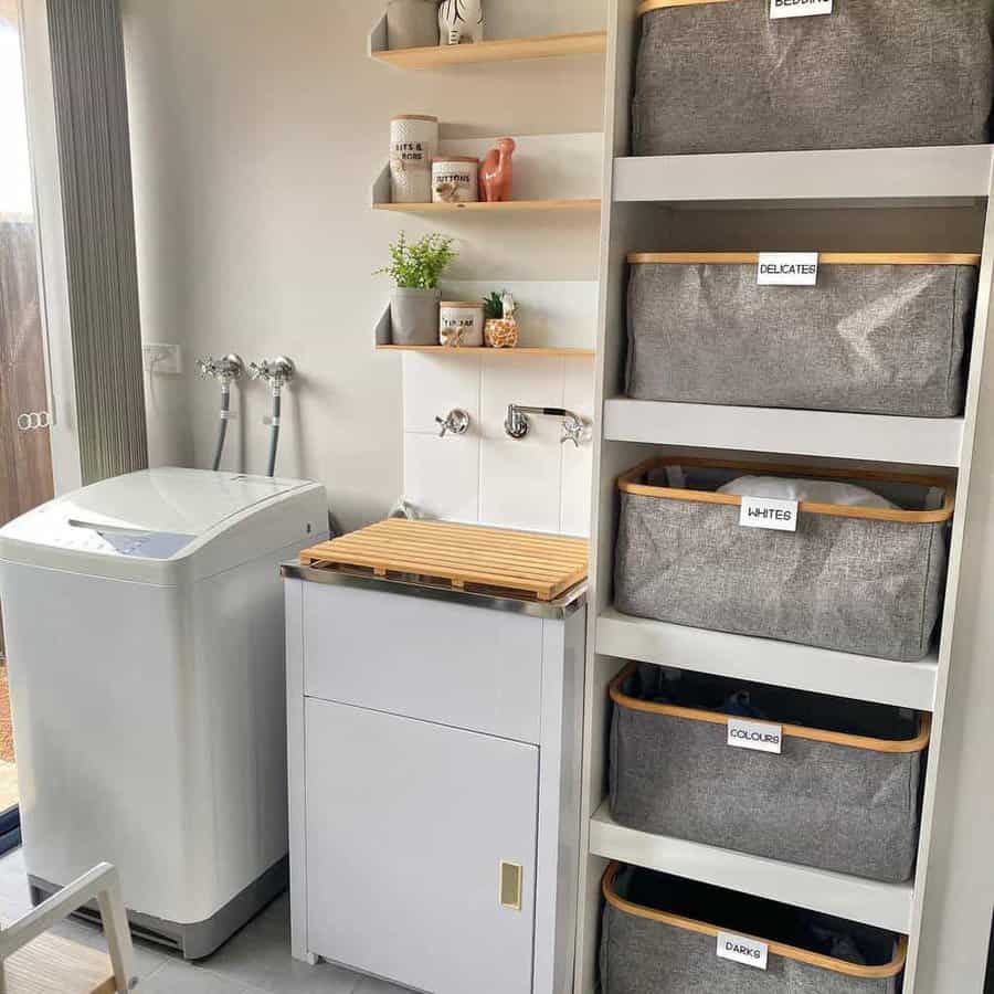 laundry room with cabinetry and organizers 
