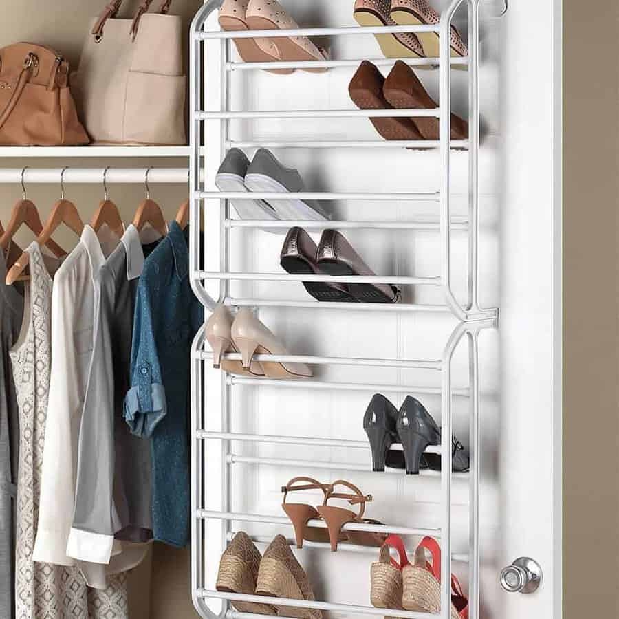 Over-the-door shoe rack with various shoes, next to a closet with clothes hanging and bags on the shelf