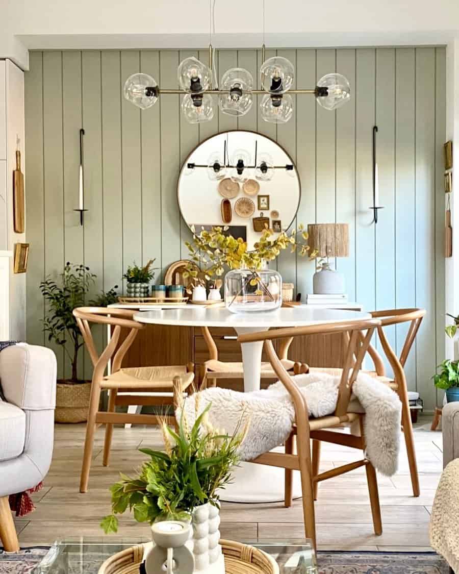 Cozy dining area with modern decor and green accent wall