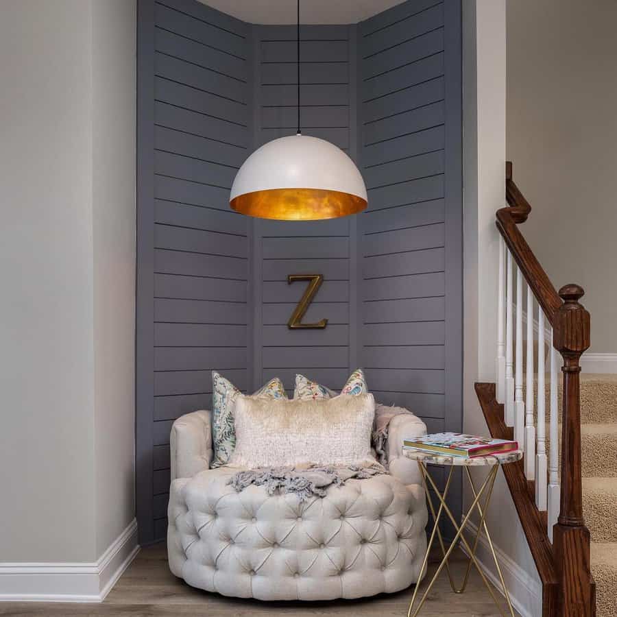 Nook with tufted sofa and shiplap walls