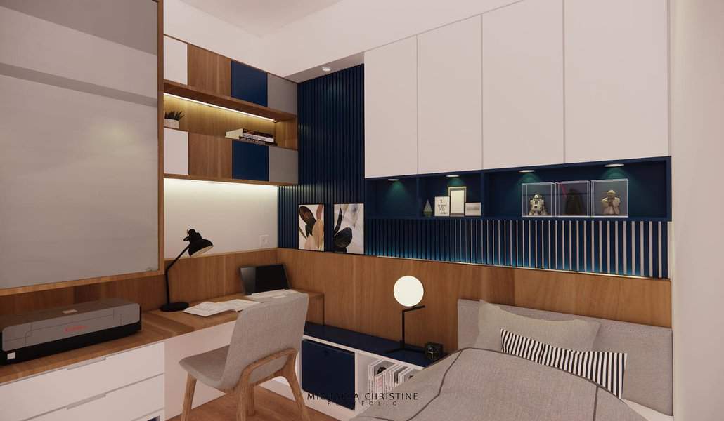 Stylish bedroom office with a built-in wood and navy desk, overhead storage, and warm lighting, creating a cozy and functional workspace