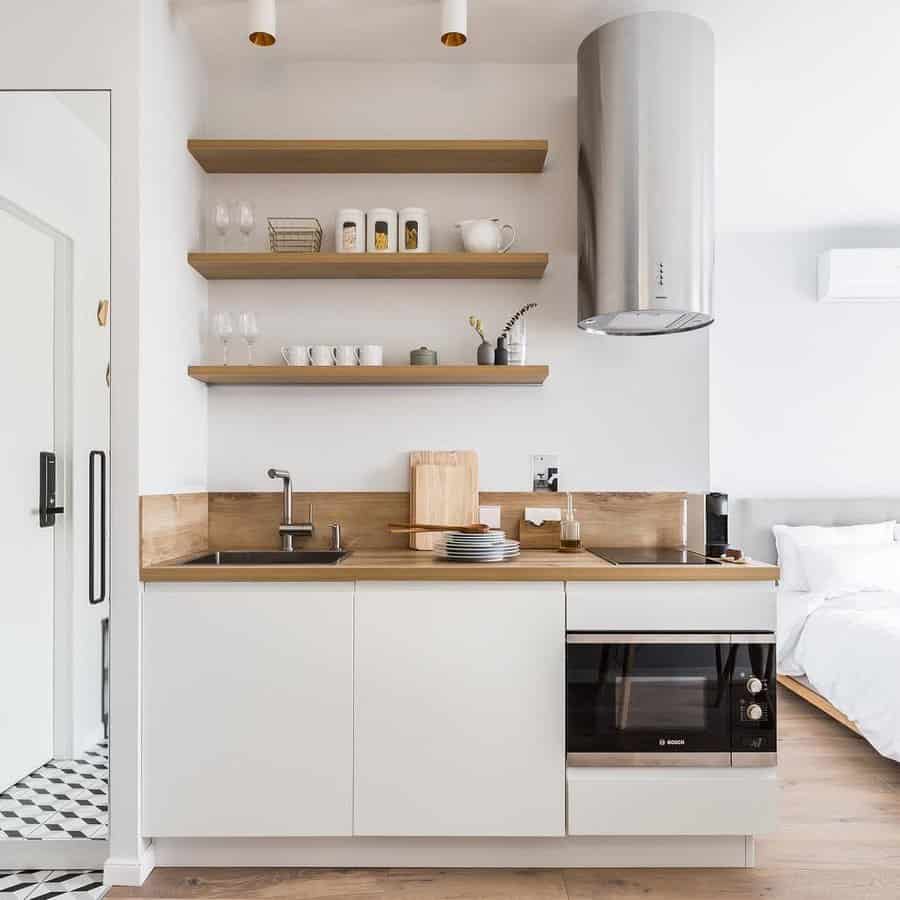 white and wood apartment kitchen