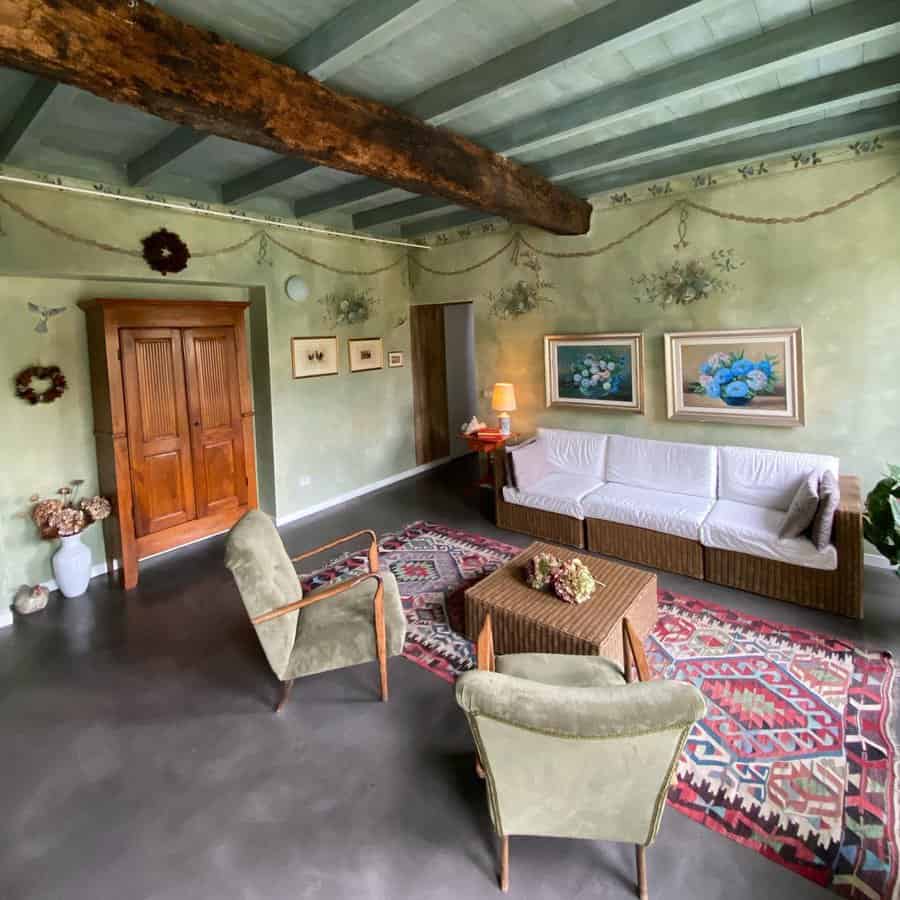 Vintage living room with floral wall decor and beams