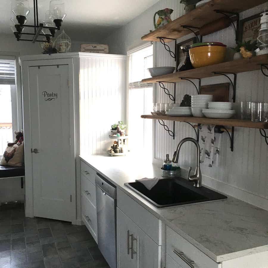 Small galley kitchen with wall shelves