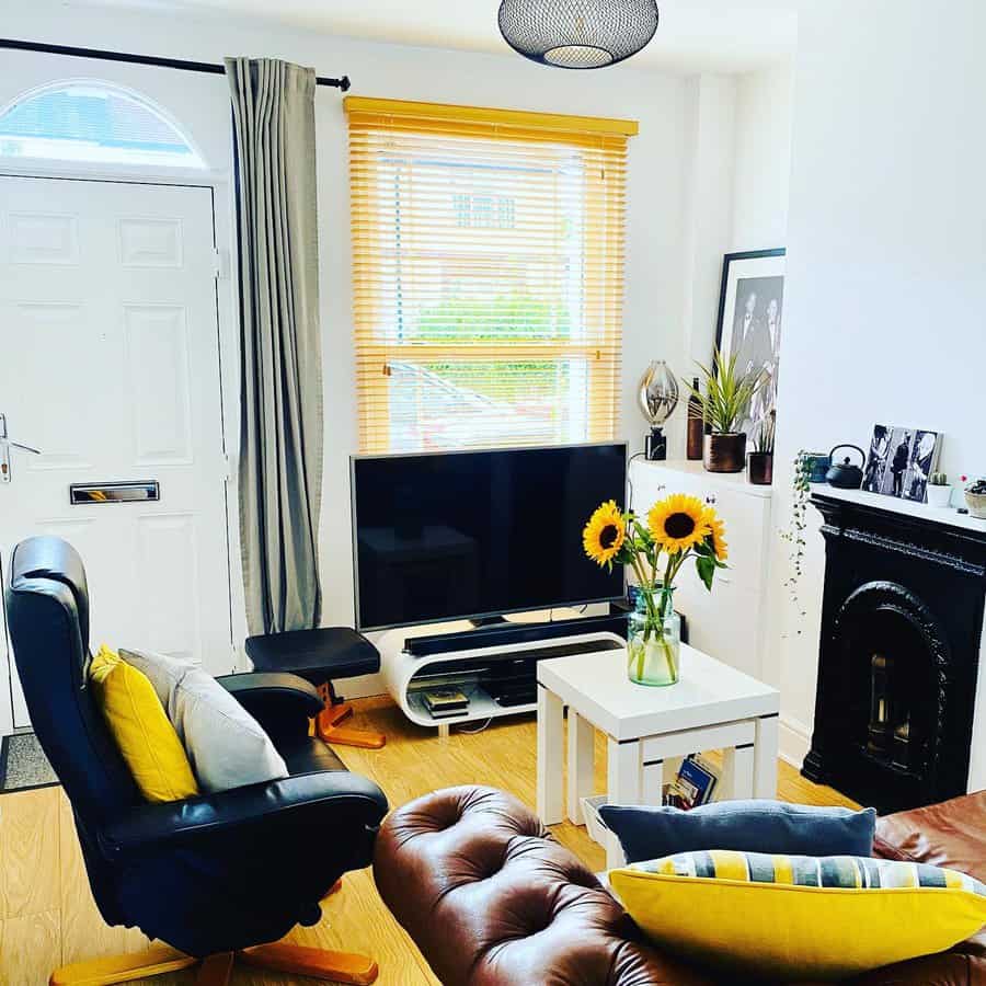 Bright living room with sunflowers and leather sofa