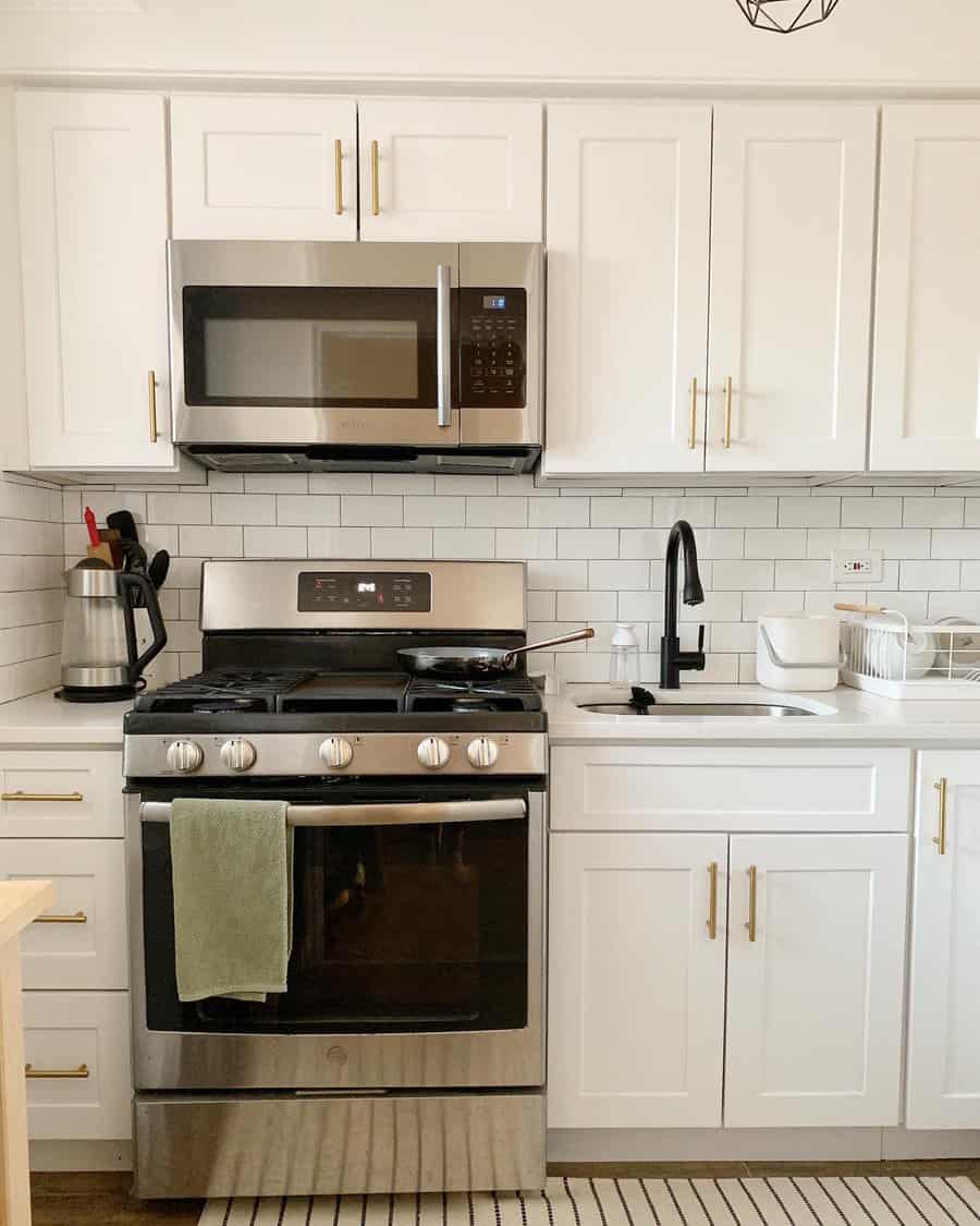 apartment kitchen with mounted microwave