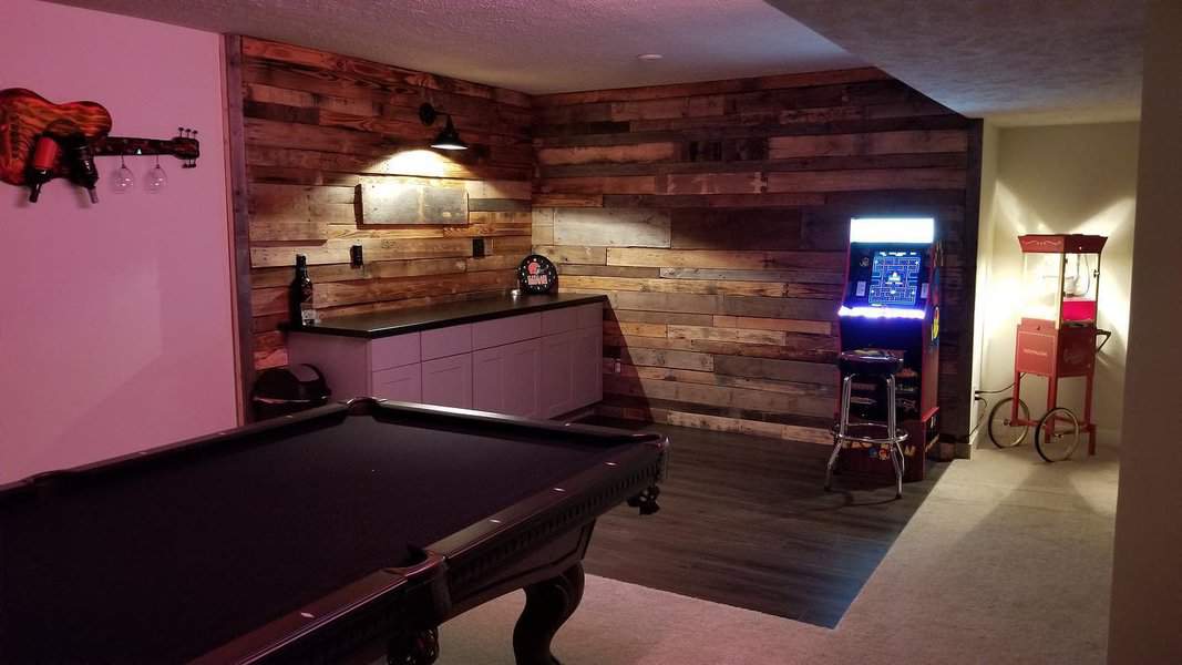 Recreational room with pool table and arcade game