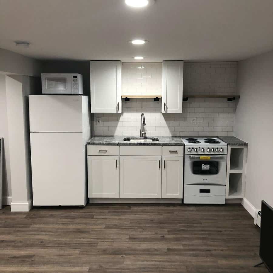 apartment kitchen with floating shelves